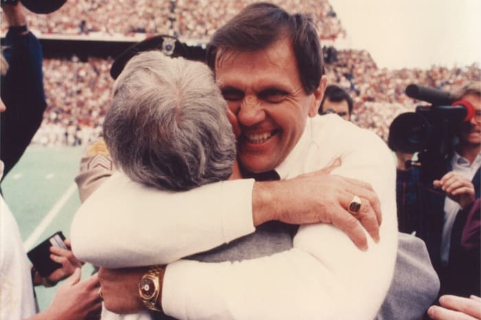 Former Texas A&M Aggies coach Jackie Sherrill hugs his then-defensive coordinator, R.C. Slocum at Kyle Field.